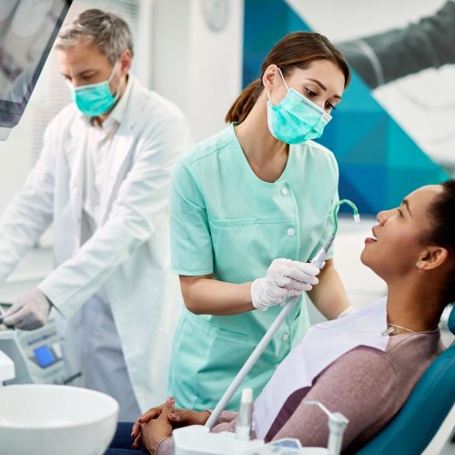 African American woman having dental treatment at dentist's office.